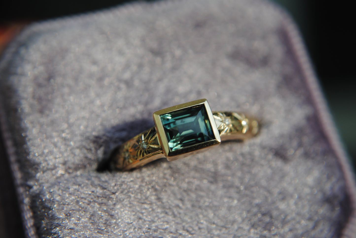 1.1 carat teal baguette sapphire and diamond stars ring