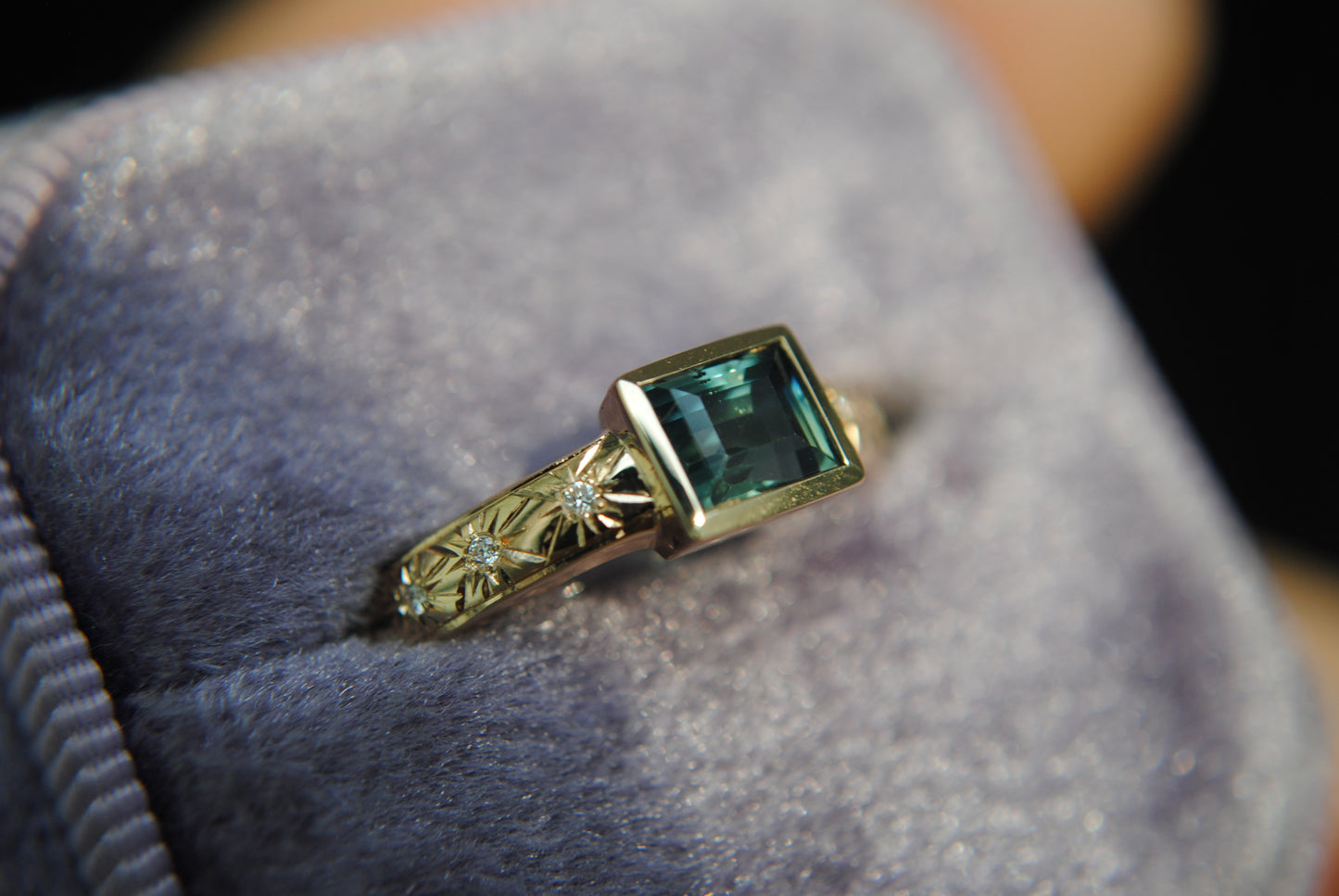 1.1 carat teal baguette sapphire and diamond stars ring