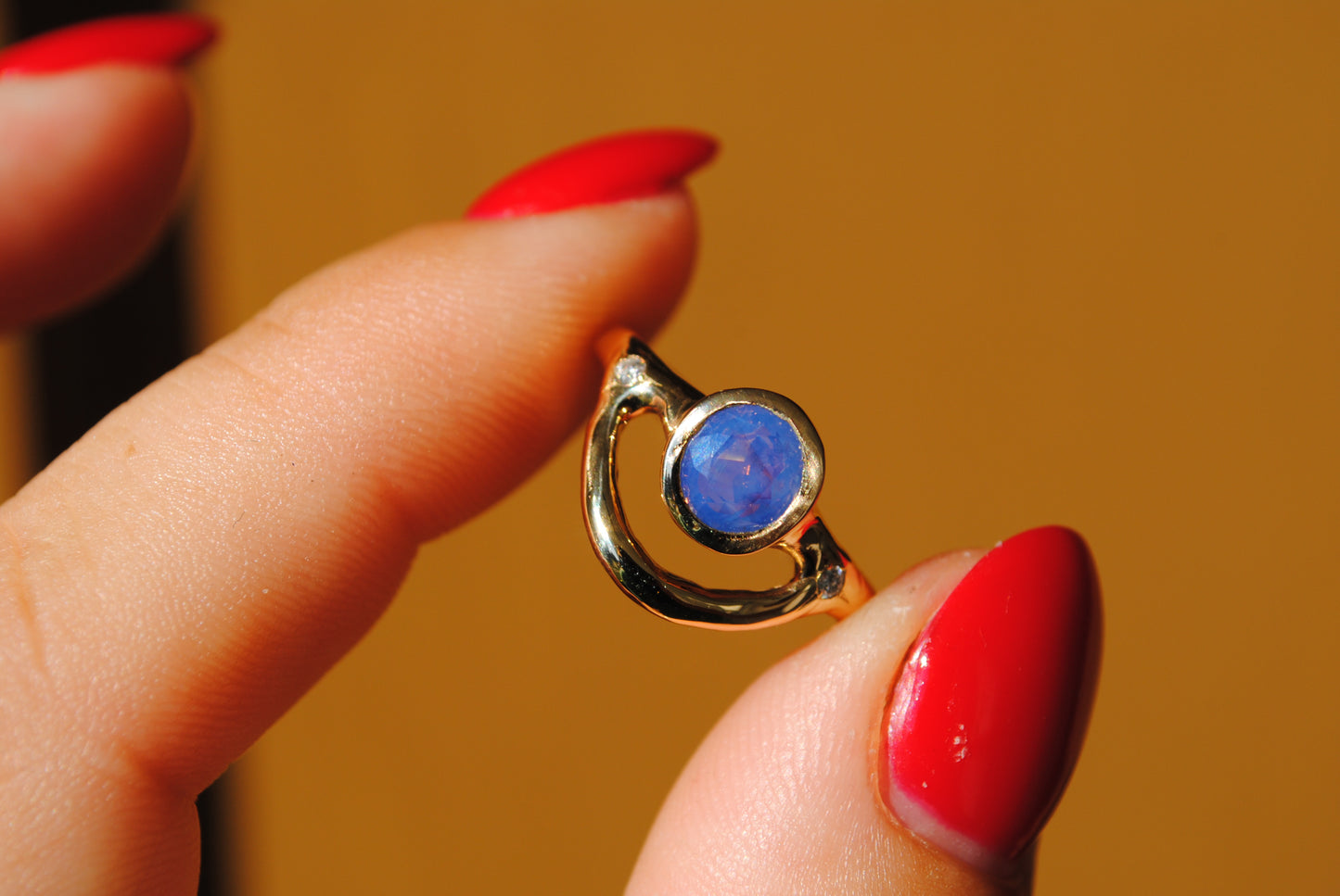 Bowed Opalescent Sapphire Ring