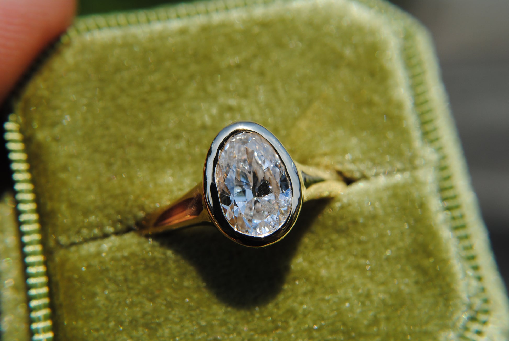 Diamond ring in a green velvet box