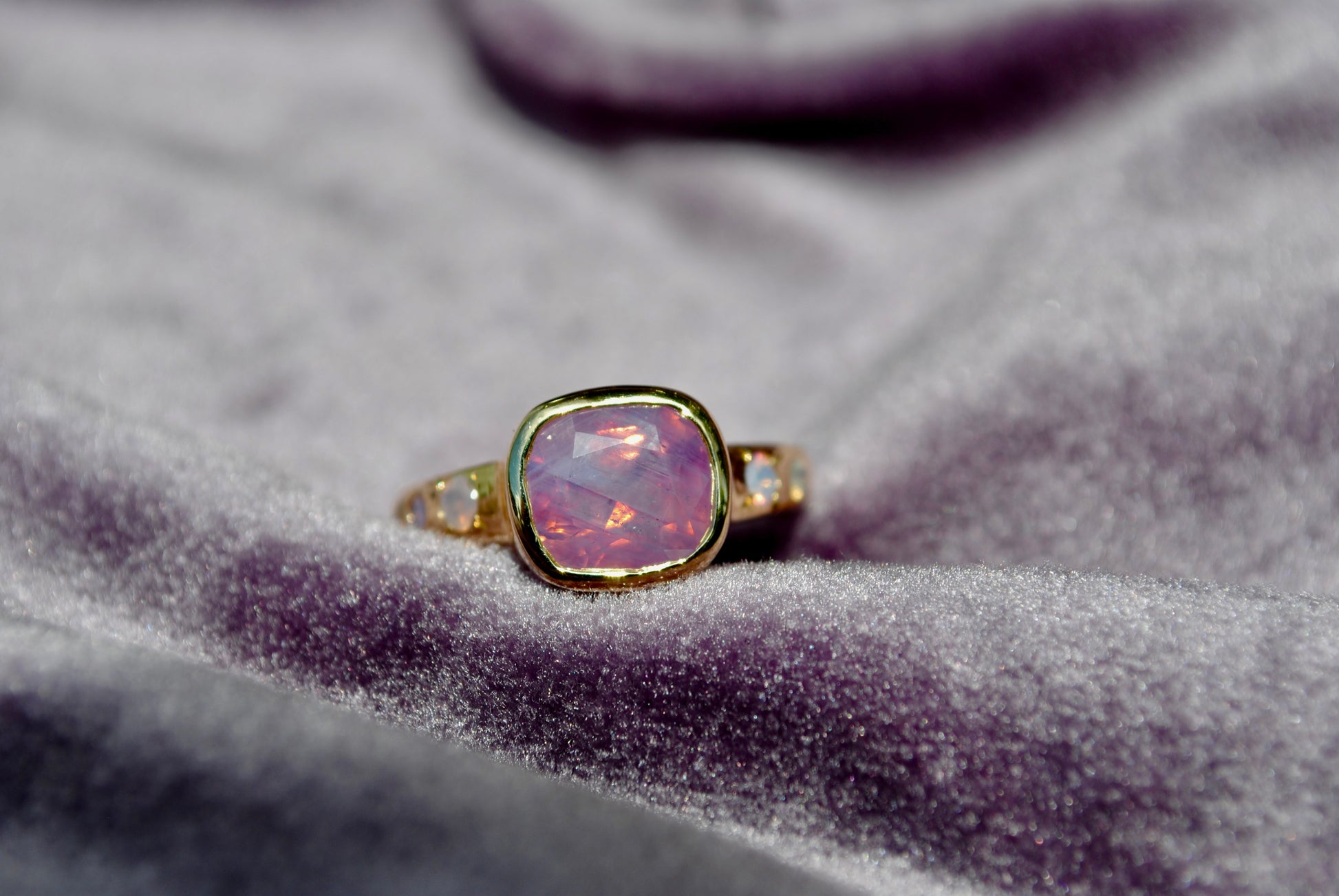 sapphire ring nestled in purple velvet 
